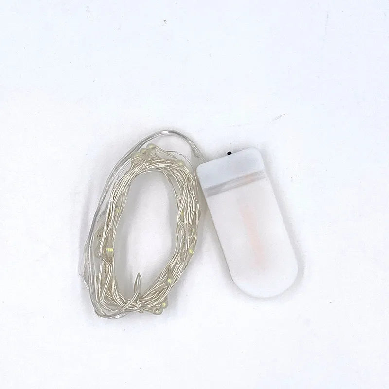 Guirnalda de luces LED de 2 m con 20 LED, 20 microluces estrelladas, funciona con pilas de botón CR2032, de cobre, ideal para decoraciones navideñas y de bodas.