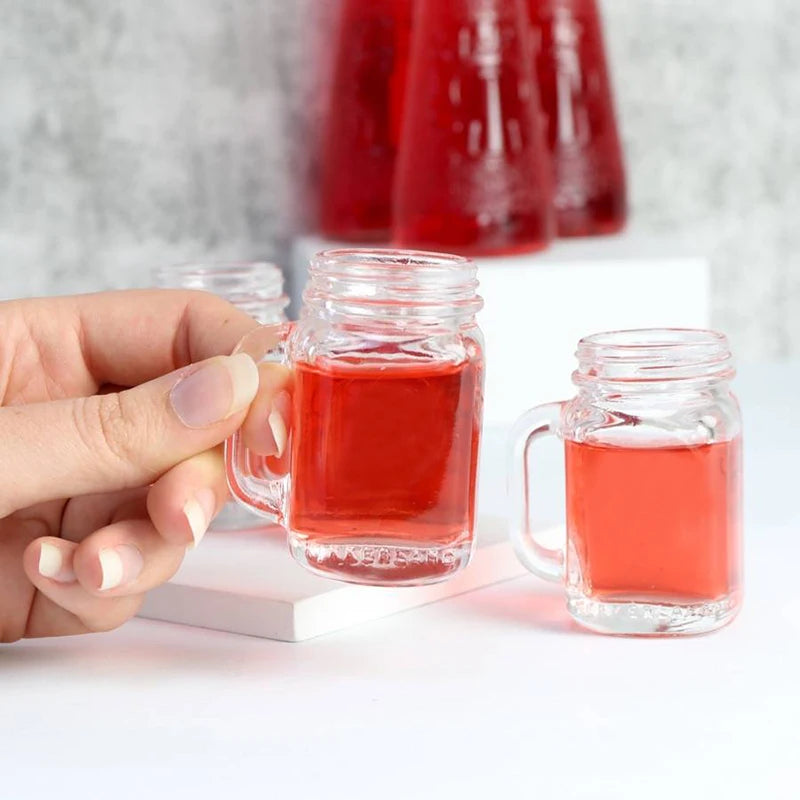 Juego de 4 mini vasos de cristal tipo tarro Mason con asas de cristal, ideales para beber whisky.