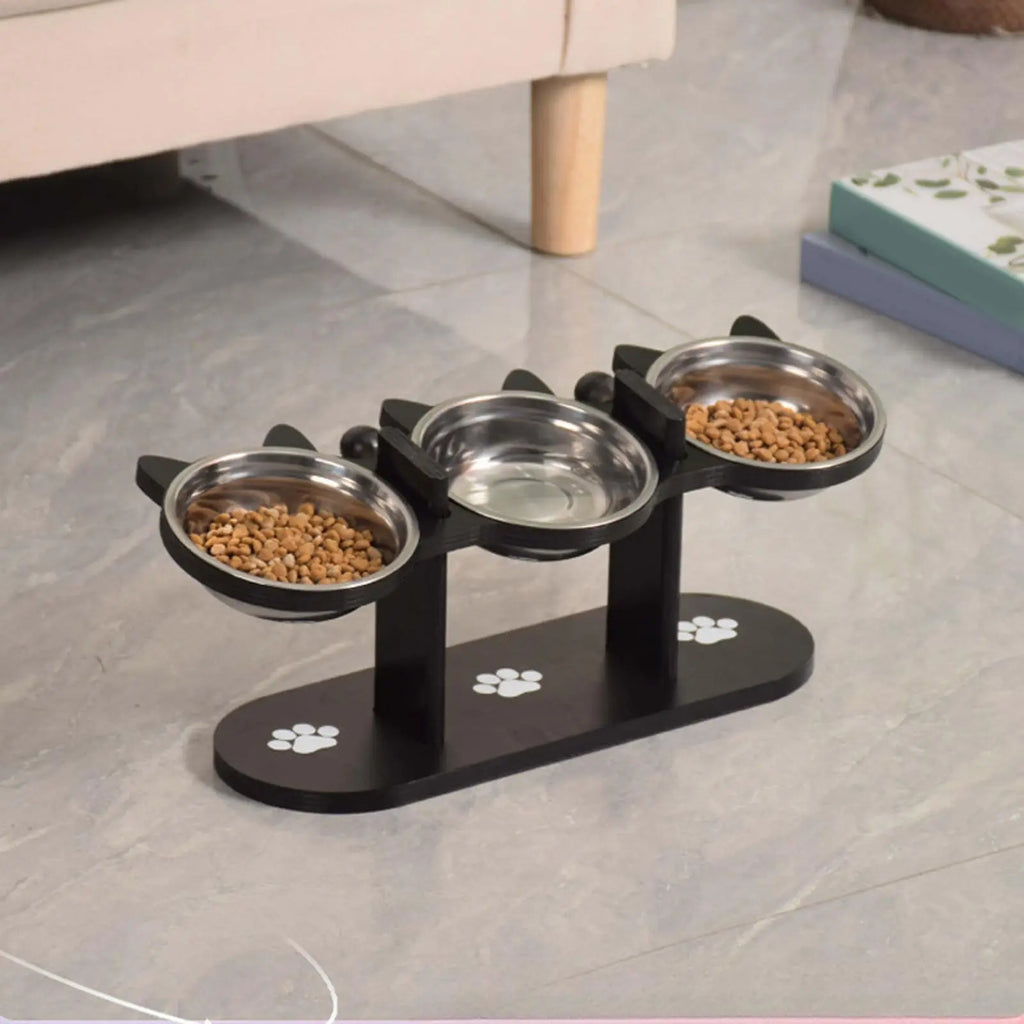 Comedero elevado para gatos con estructura de soporte de madera negra, cuencos de acero inoxidable para gatos, soporte inclinado de 15°, suministros para alimentación y agua.