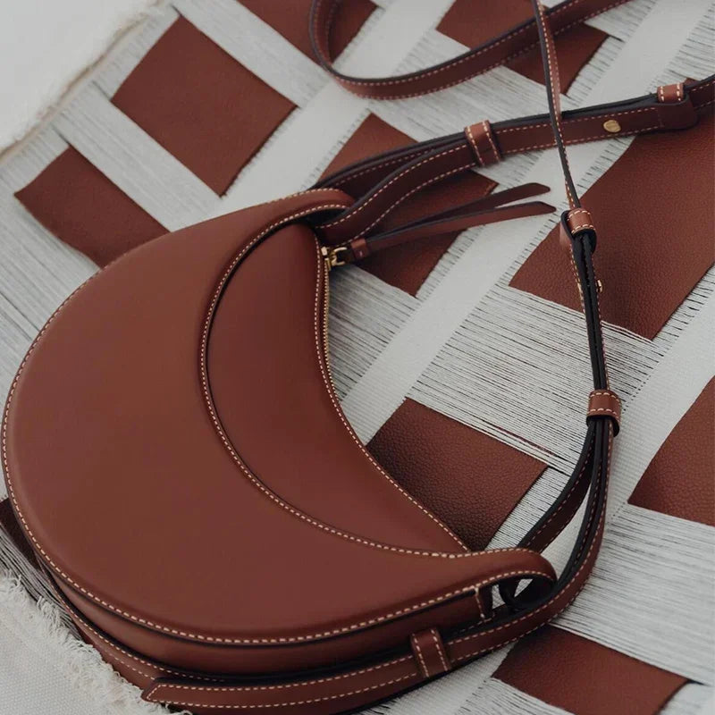 Bolso de hombro de moda para mujer 2026, bolso en forma de media luna, bolso bandolera con cremallera de diseño exclusivo.