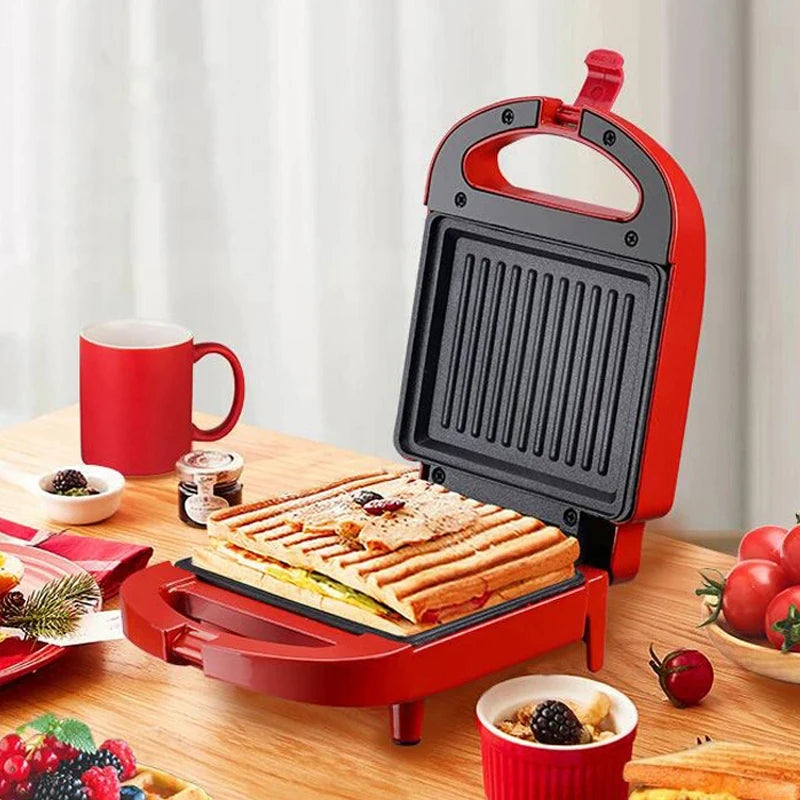 Sandwichera eléctrica portátil, máquina multifuncional para el hogar, antiadherente, para preparar desayunos, gofres y otros alimentos. Color rosa y rojo.