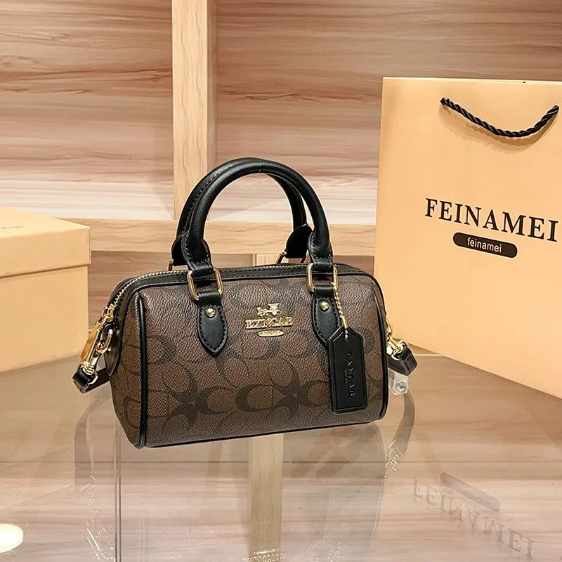 Bolso de mano Boston de lujo ligero para mujer, nuevo bolso bandolera de otoño/invierno 2026, estilo retro de alta gama, bolso de hombro único.
