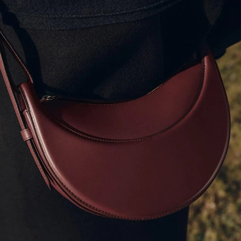 Bolso de hombro de moda para mujer 2026, bolso en forma de media luna, bolso bandolera con cremallera de diseño exclusivo.
