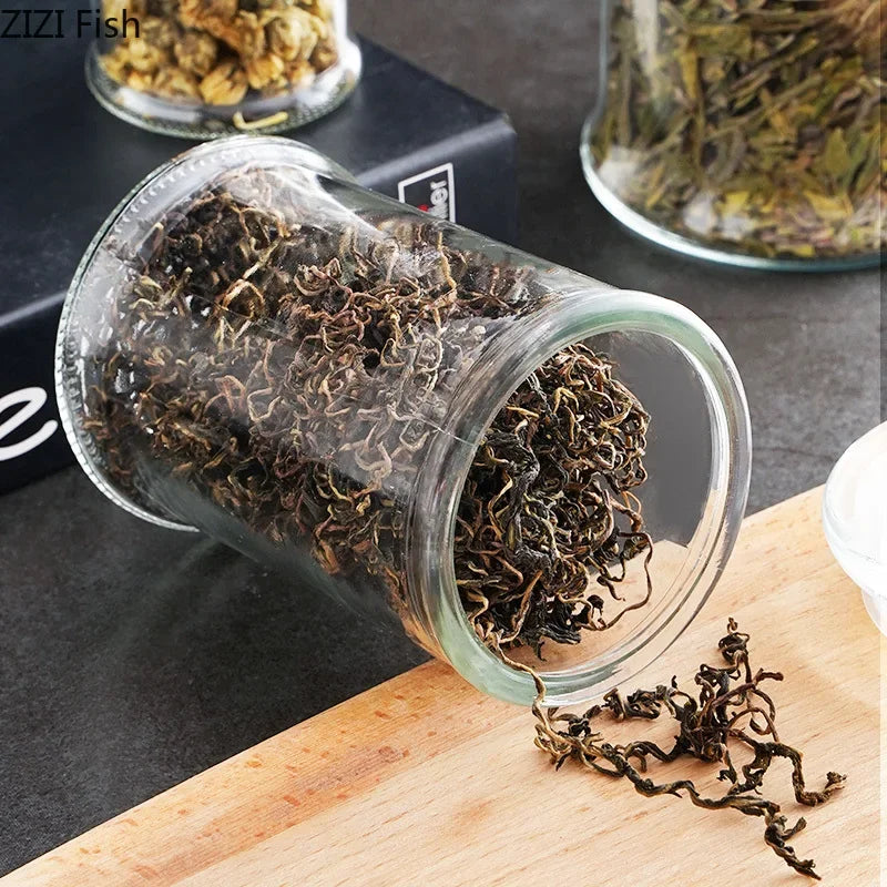 Tarros de almacenamiento de vidrio transparentes minimalistas con tapa, ideales para té, dulces, decoración de escritorio o como dispensador de cereales.