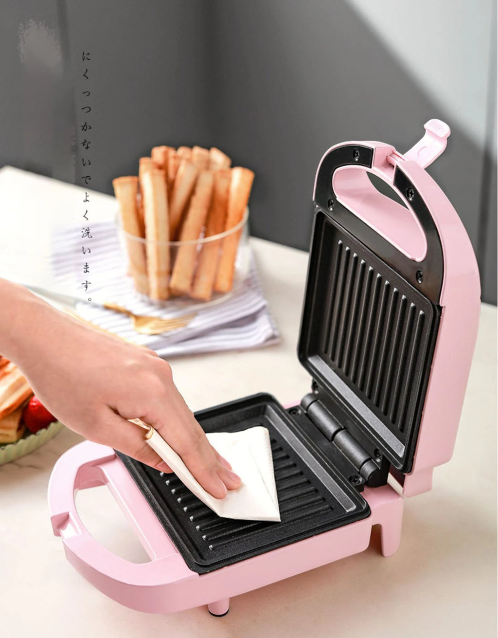Sandwichera eléctrica portátil, máquina multifuncional para el hogar, antiadherente, para preparar desayunos, gofres y otros alimentos. Color rosa y rojo.