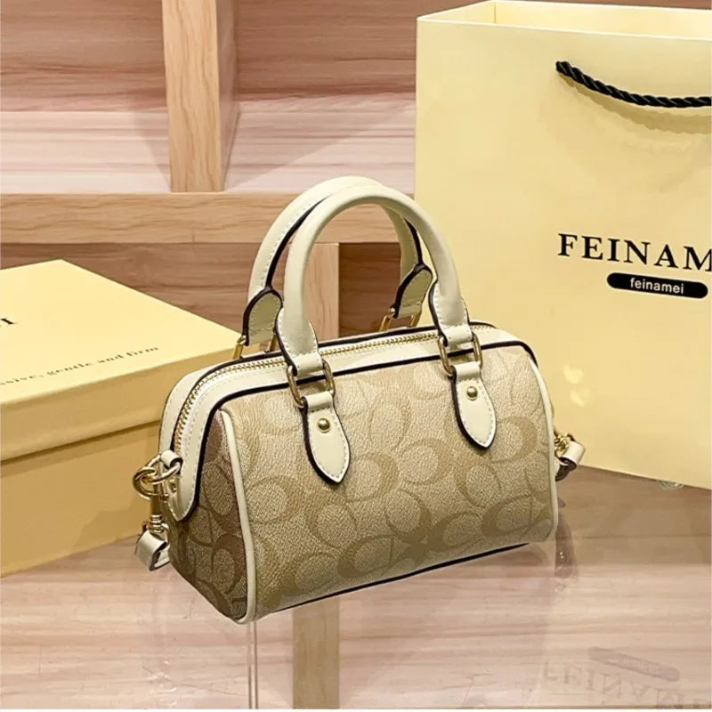 Bolso de mano Boston de lujo ligero para mujer, nuevo bolso bandolera de otoño/invierno 2026, estilo retro de alta gama, bolso de hombro único.