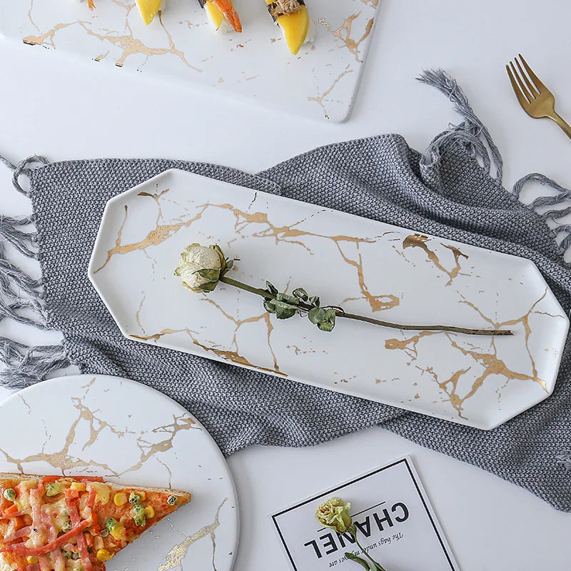 Vajilla de cerámica blanca, negra y dorada, ideal para pizza, postres, filetes y como bandeja decorativa.