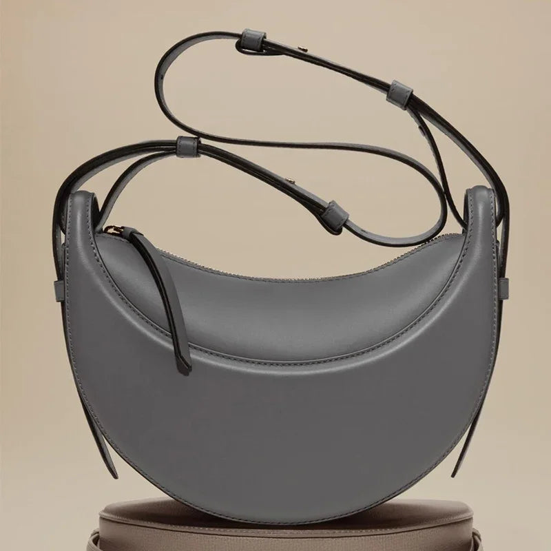 Bolso de hombro de moda para mujer 2026, bolso en forma de media luna, bolso bandolera con cremallera de diseño exclusivo.