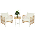 Conjunto de jardín de exterior Outsunny de ratán con 1 mesa y 2 sillas con cojines color crema.