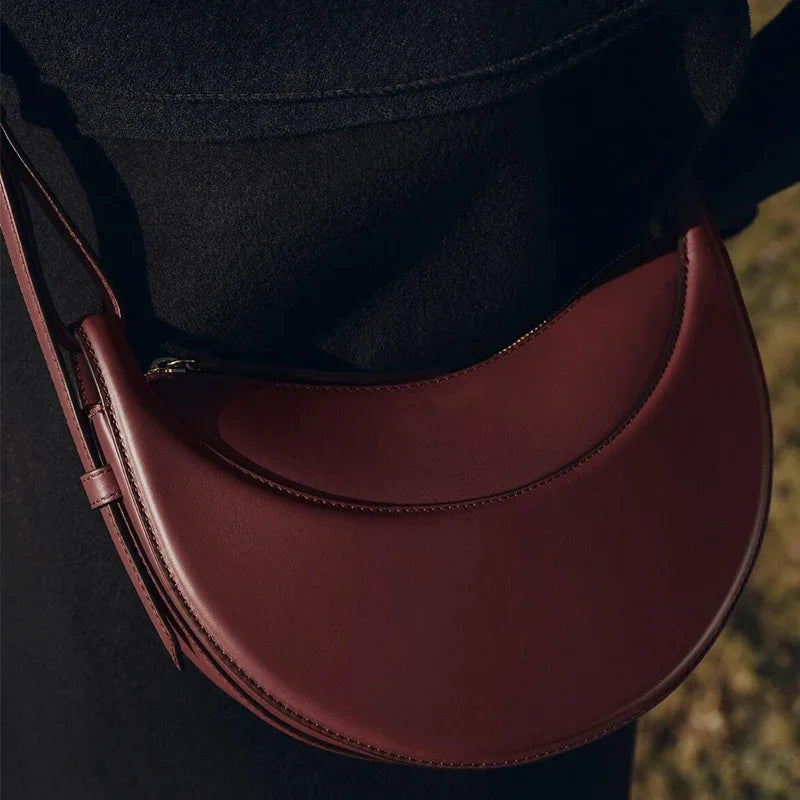 Bolso de hombro de moda para mujer 2026, bolso en forma de media luna, bolso bandolera con cremallera de diseño exclusivo.