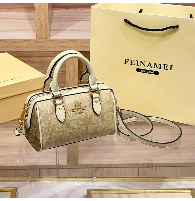 Bolso de mano Boston de lujo ligero para mujer, nuevo bolso bandolera de otoño/invierno 2026, estilo retro de alta gama, bolso de hombro único.