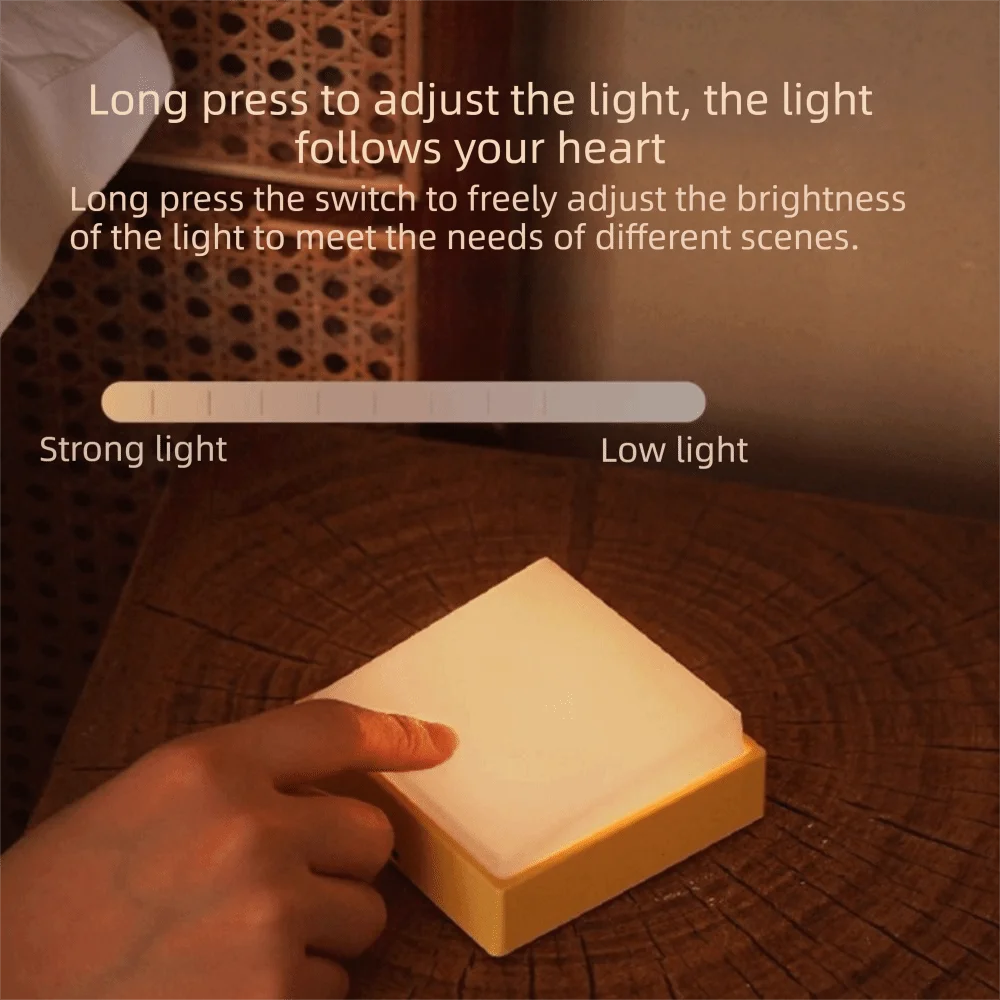Luz nocturna LED con atenuación continua, protección ocular, succión magnética, diseño blanco y amarillo, carga USB.