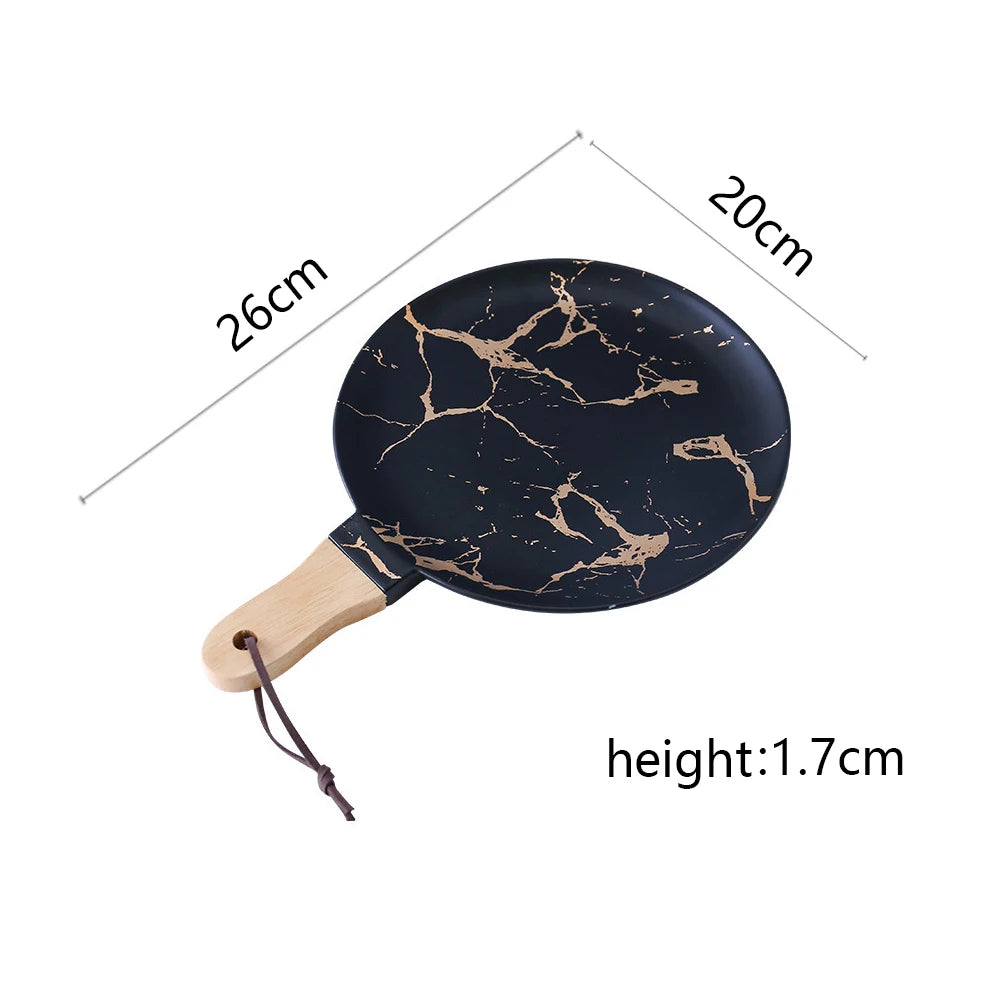 Vajilla de cerámica blanca, negra y dorada, ideal para pizza, postres, filetes y como bandeja decorativa.
