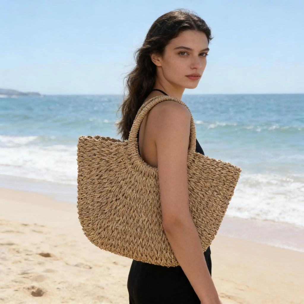 Bolso de hombro de playa de lujo con diseño hueco, bolso de paja de marca de alta calidad para mujer, cesta de viaje tejida de rafia de verano.