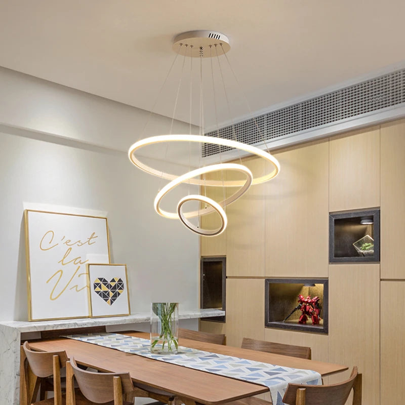 Lámpara colgante moderna con anillos LED circulares, araña de techo negra, ideal para lofts, salas de estar, comedores y cocinas. Iluminación interior.