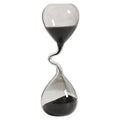 Decoración minimalista para mesa de comedor con diseño curvo de estilo moderno en color negro y artesanía en forma de reloj de arena.