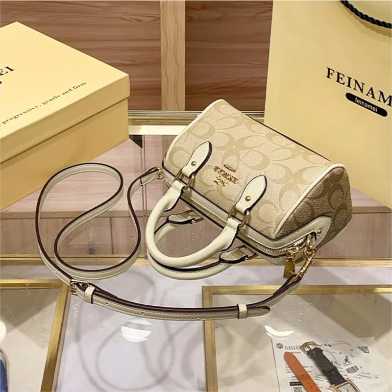 Bolso de mano Boston de lujo ligero para mujer, nuevo bolso bandolera de otoño/invierno 2026, estilo retro de alta gama, bolso de hombro único.
