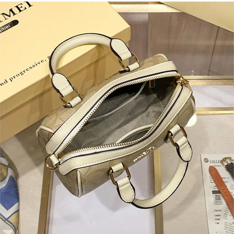 Bolso de mano Boston de lujo ligero para mujer, nuevo bolso bandolera de otoño/invierno 2026, estilo retro de alta gama, bolso de hombro único.