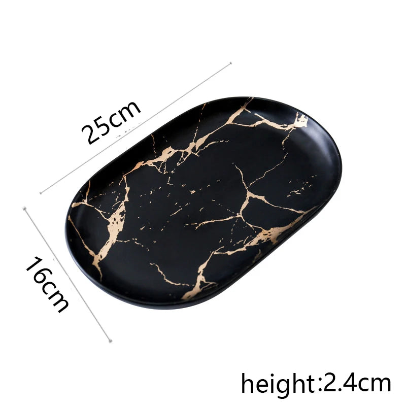 Vajilla de cerámica blanca, negra y dorada, ideal para pizza, postres, filetes y como bandeja decorativa.