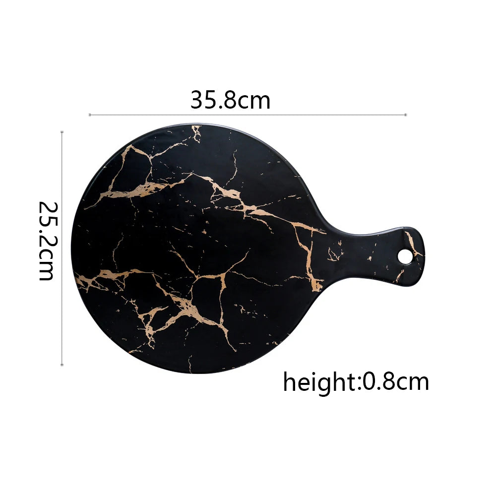 Vajilla de cerámica blanca, negra y dorada, ideal para pizza, postres, filetes y como bandeja decorativa.